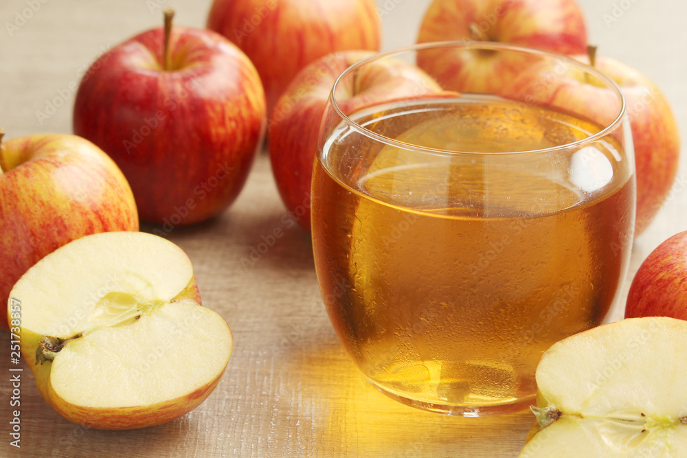 A glass with juice and apples A glass with juice and apples