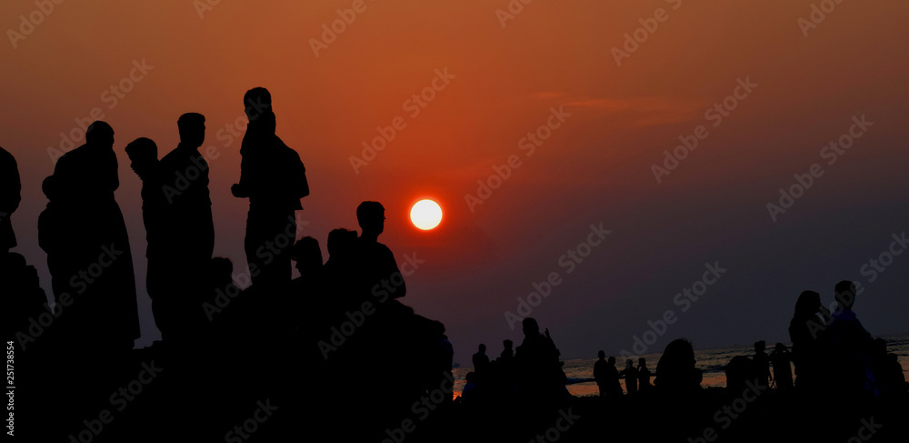Fototapeta premium Sunset with people, silhouette
