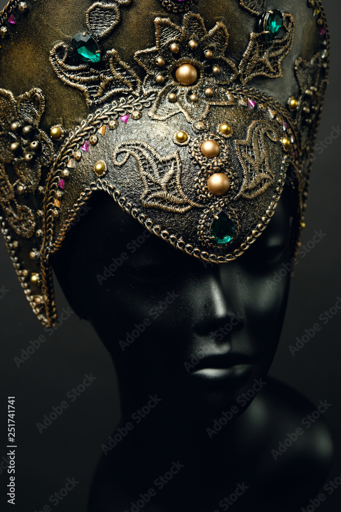 Mannequin head in creative Russian dark gold kokoshnick with jewels