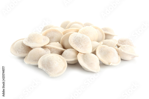 Fresh raw dumplings on white background