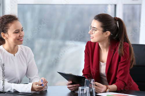 Young businesswomen at meet...