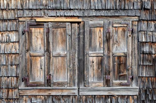 Weathered wIndow shutters of an old abandoned farmhouse