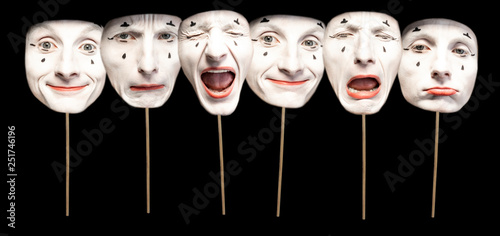 Masks with different emotions of pantomime on the black background