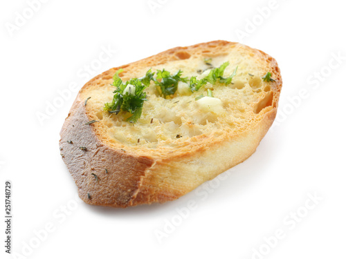 Sliced bread with garlic, olive oil and herbs on white background