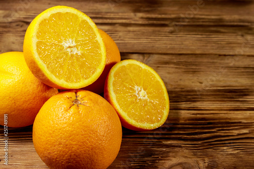 Fresh oranges on wooden table