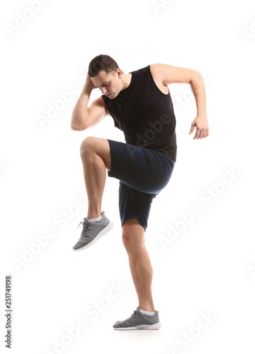 Sporty young man training against white background © Pixel-Shot