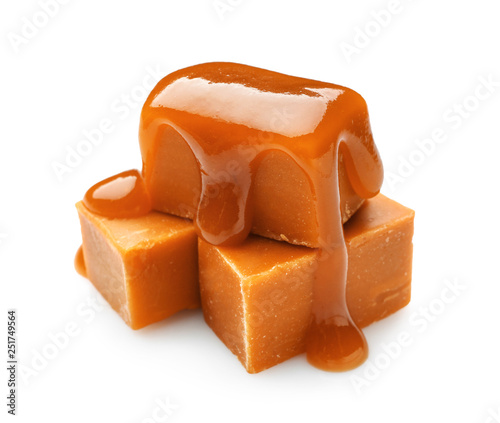Tasty sweet caramel on white background