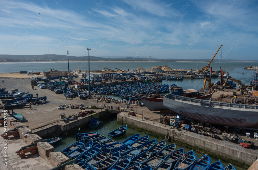View to fishing boats in Essaouira harbour and cannons in Skala du Port ( Northern Skala ), Morocco