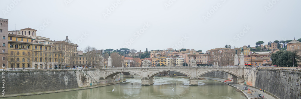 View on famous Saint Angel castle and bridge over the Tiber river in Rome, Italy. World famous landmark.