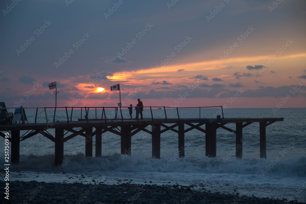 over Terrace dock or pier. Dock sea and cloudy sky background, sunset. The city embankment