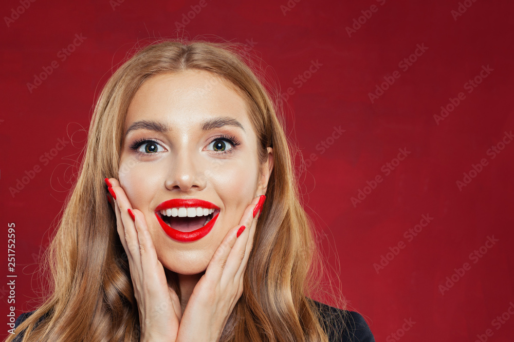 Surprised girl face on red background. Happy woman closeup portrait Surprised girl face on red background. Happy woman closeup portrait