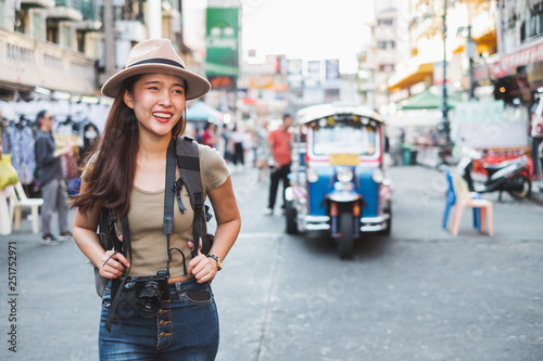 Photography Asian woman tourist backpacker travel in Khao San road, Bangkok, Thailand