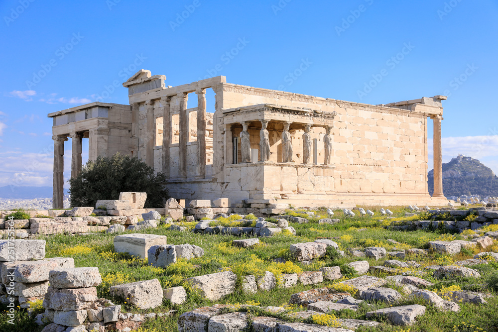Erechtheion Temple with Caryatid Porch on the Acropolis of Athens, Greece. World heritage ancient architecture monuments. Ancient Greek ruins in Athens center.