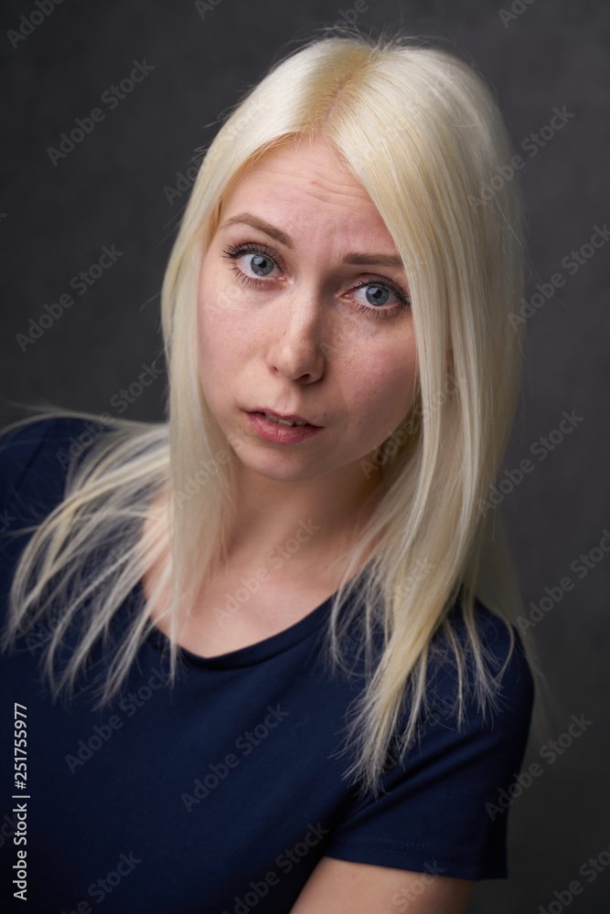 beauty female blond in black casual clothes on gray background beauty female blond in black casual clothes on gray background