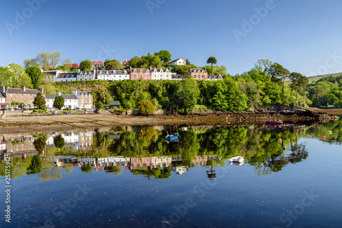 Reflection at water in town Portree, Scotland