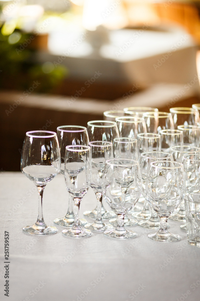 Glasses for wine and champagne at a buffet table Glasses for wine and champagne at a buffet table