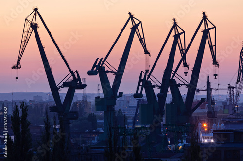Gdansk, Poland. Silhouettes of port cranes at sunset photo