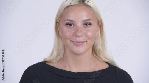 Face of young happy blonde woman nodding head yes