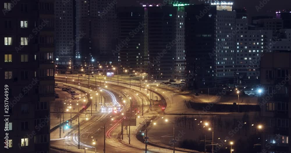 Timelapse traffic at night in big city Minsk, Belarus. Bright lights are burning in the streets.