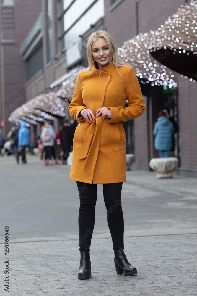 young stylish beautiful woman walking in street, wearing, fashion outfit, autumn trend 