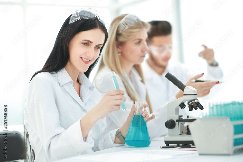group of young scientists conduct research in the laboratory . group of young scientists conduct research in the laboratory .