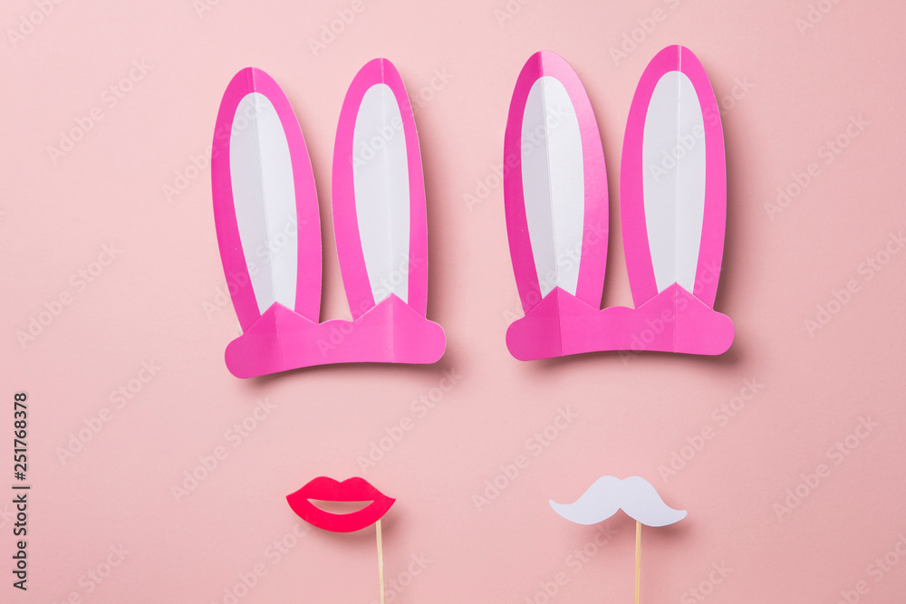 Pink Easter bunny ears and red lips. Minimal lay flat design