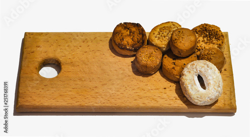 Traditional Spanish Christmas candy ( Polvorones ) on a wood tray. Sweet snack. Mantecado.