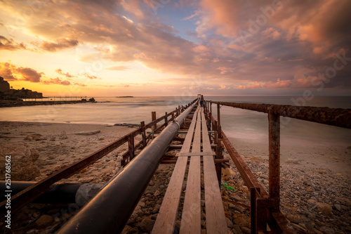 old wooden pier at sunset