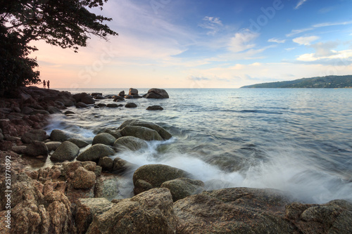 beach with boulders on the ocean shore