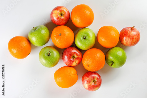 red green apple orange fruit on white background