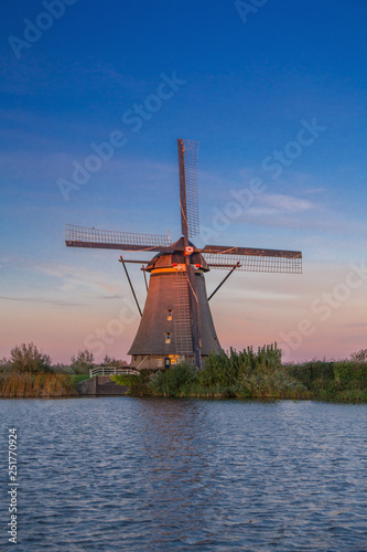 The sunset view of traditional Dutch windmill in Kinderdijk, Netherlands