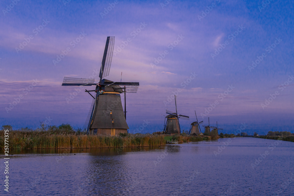 The sunset view of traditional Dutch windmill in Kinderdijk, Netherlands