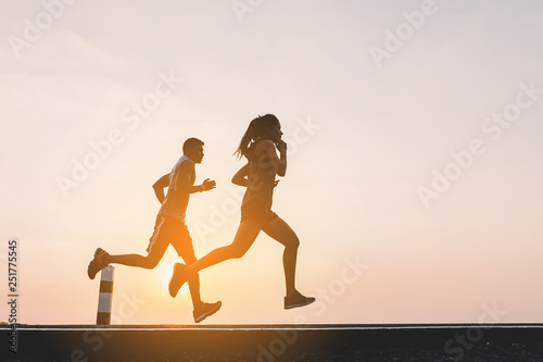 Wallpaper Mural young couple runner running on running road in city park Torontodigital.ca