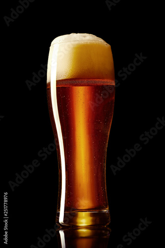 Classic dunkel beer in a glass studio shot on a black background.