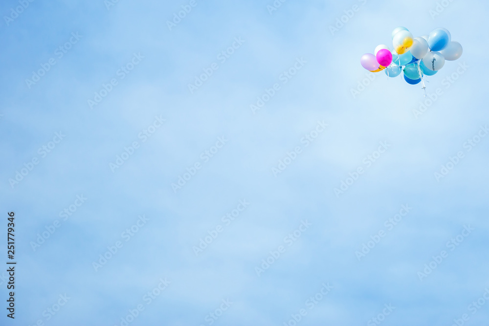 Many Flying Balloon in education celebration fair on the blue sky.
