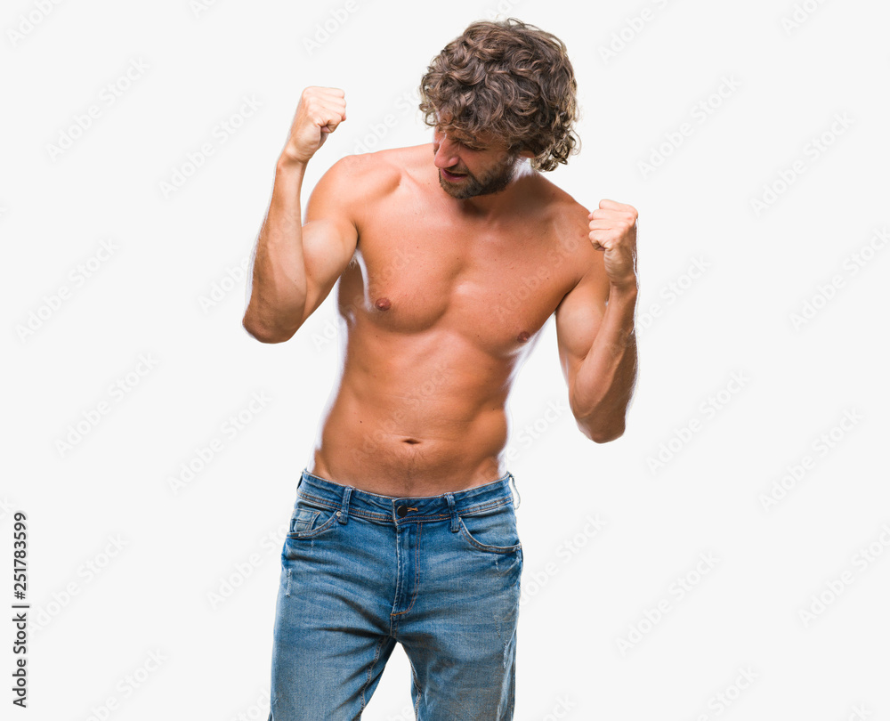 Handsome hispanic model man sexy and shirtless over isolated background very happy and excited doing winner gesture with arms raised, smiling and screaming for success. Celebration concept. Handsome hispanic model man sexy and shirtless over isolated background very happy and excited doing winner gesture with arms raised, smiling and screaming for success. Celebration concept.