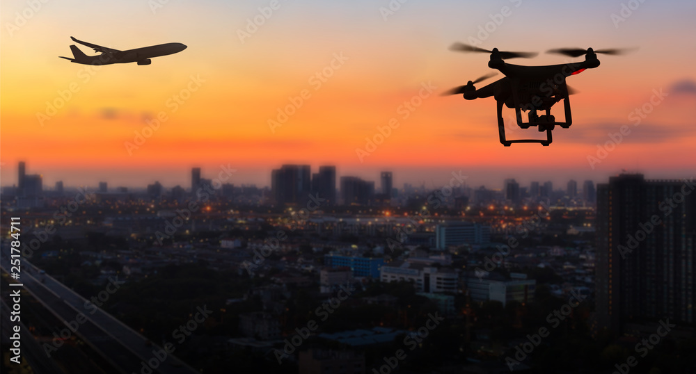 Silhouette of drone flying near an airport with airplane, no drone zone concept - obrazy, fototapety, plakaty 