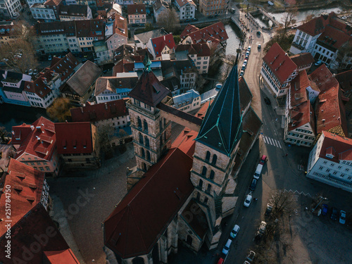 Aerial drone shot of a beautiful old and medieval church in the traditional City of Esslingen am Neckar in South Germany © SmallWorldProduction