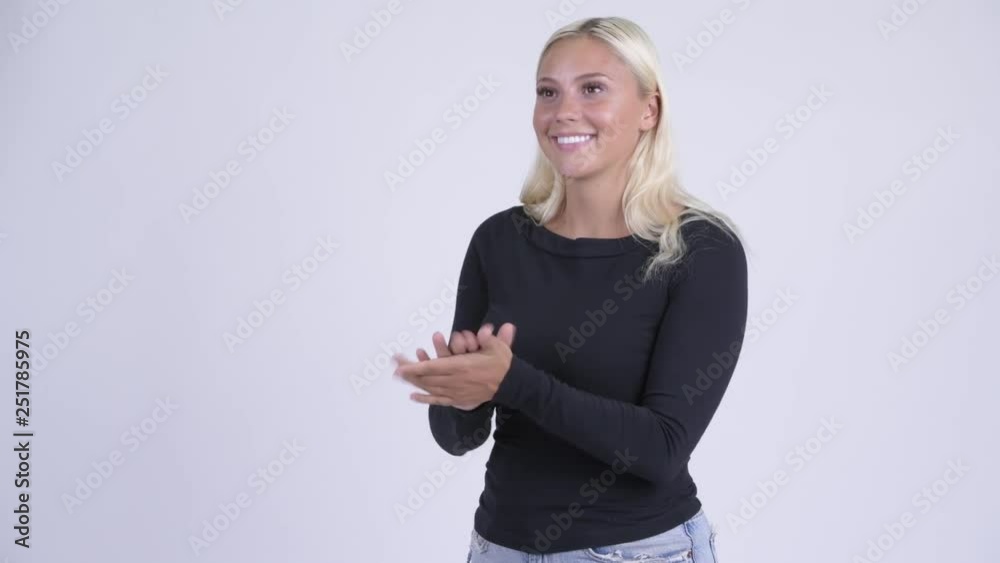 Young happy blonde woman clapping hands Young happy blonde woman clapping hands