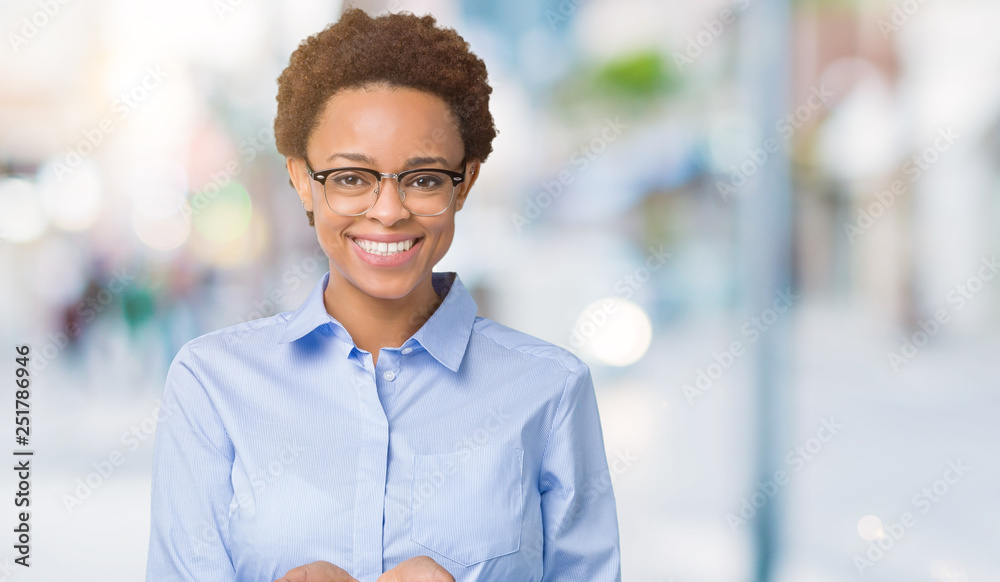 Young beautiful african american business woman over isolated background Smiling with hands palms together receiving or giving gesture. Hold and protection Young beautiful african american business woman over isolated background Smiling with hands palms together receiving or giving gesture. Hold and protection