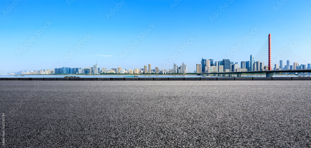 Empty asphalt road and modern city skyline with buildings in Hangzhou