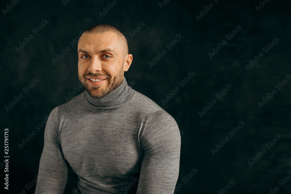 Naklejka premium Studio fashion portrait. Elegant young handsome happy man.
