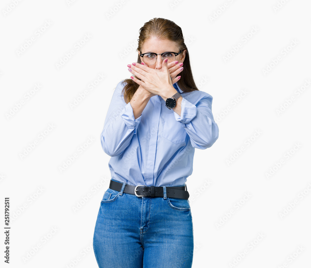 Beautiful middle age mature business woman wearing glasses over isolated background shocked covering mouth with hands for mistake. Secret concept. Beautiful middle age mature business woman wearing glasses over isolated background shocked covering mouth with hands for mistake. Secret concept.