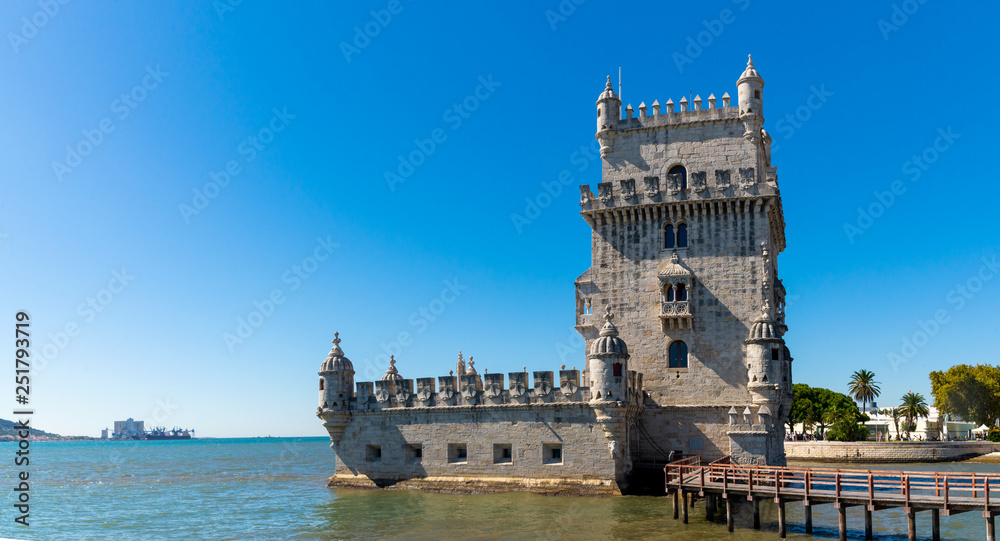 Scenic Belem Tower and wooden bridge miroring with low tides on Tagus River. Torre de Belem is Unesco Heritage and icon of Lisbon and the most visited attraction in Lisbon, Belem District, Portugal