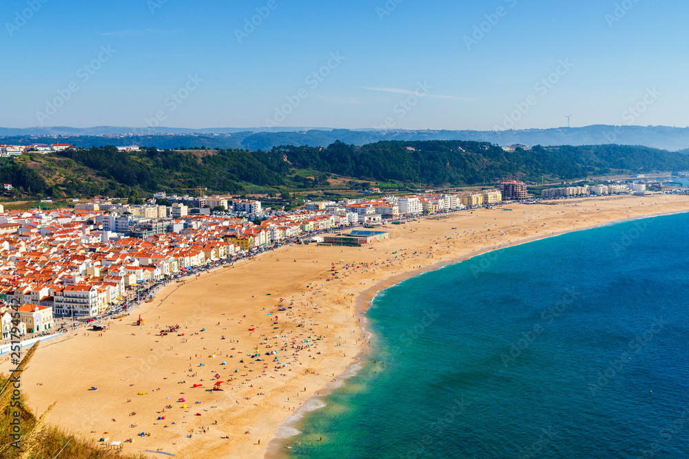 From the high point of the Nazare we can see the beach the sea and the village Nazare, Portugal