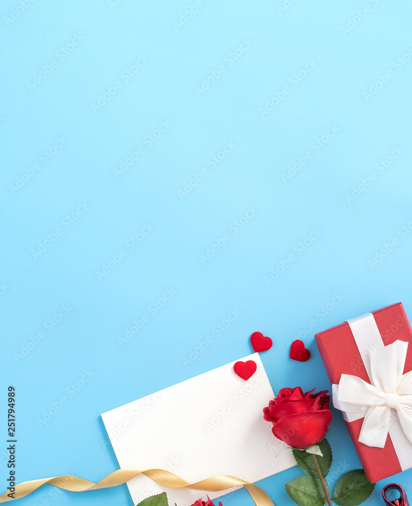 Beautiful greeting invitation card, concept of mother day, Valentine day, anniversary and birthday isolated on blue color background, copy space, top view, mock up, flat lay Beautiful greeting invitation card, concept of mother day, Valentine day, anniversary and birthday isolated on blue color background, copy space, top view, mock up, flat lay