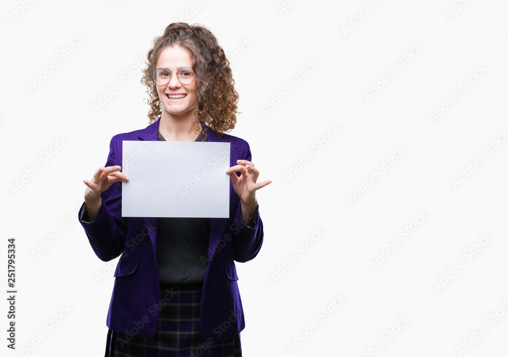 Young brunette student girl wearing school uniform holding blank paper over isolated background with a happy face standing and smiling with a confident smile showing teeth Young brunette student girl wearing school uniform holding blank paper over isolated background with a happy face standing and smiling with a confident smile showing teeth