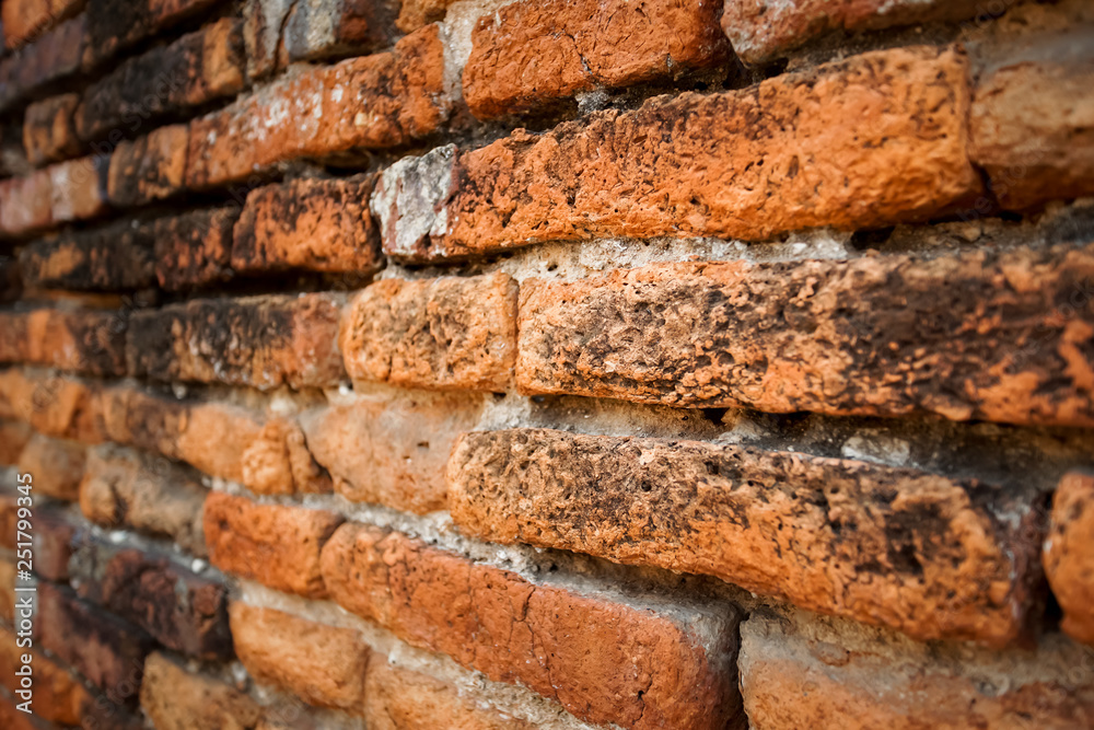 Old brick wall in Wat Thammikarat Ayutthaya, Thailand.