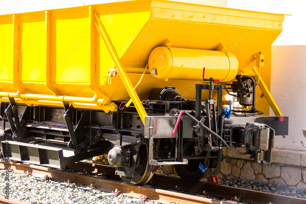 Ballast train. A large cargo yellow train at the station