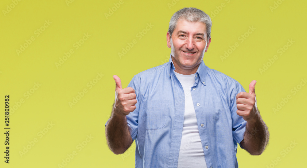 Handsome senior man over isolated background success sign doing positive gesture with hand, thumbs up smiling and happy. Looking at the camera with cheerful expression, winner gesture. Handsome senior man over isolated background success sign doing positive gesture with hand, thumbs up smiling and happy. Looking at the camera with cheerful expression, winner gesture.